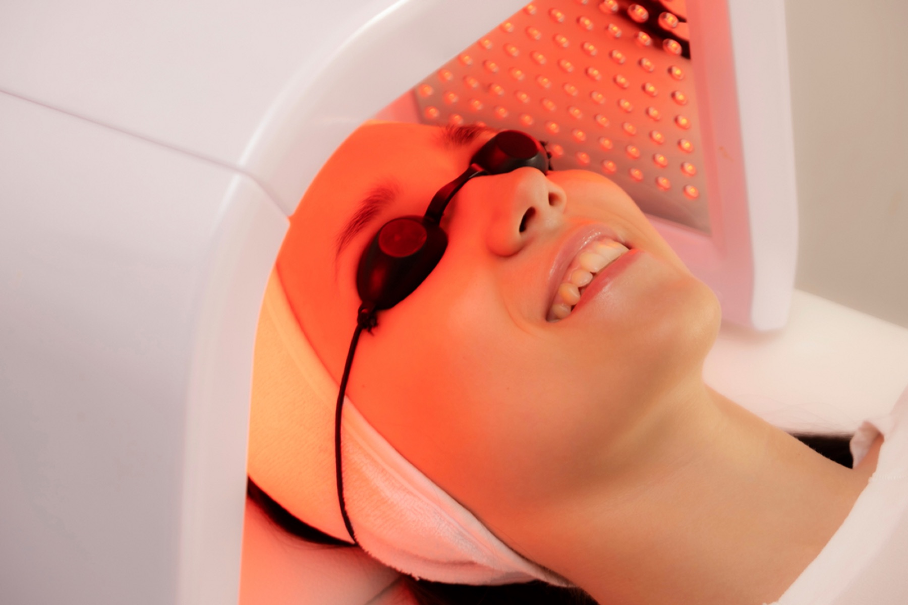 Red light facial session with protective eyewear